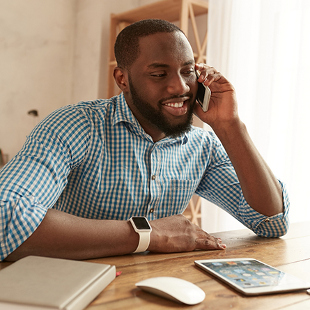 Man talking on the phone with a dental office in Portland