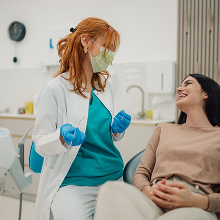 Patient smiling at dentist in treatment chair